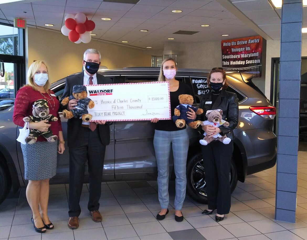 Leadership from Hospice of the Chesapeake and Hospice of Charles County with general manager of Waldorf Toyota present big check for donation to Teddy Bear Project