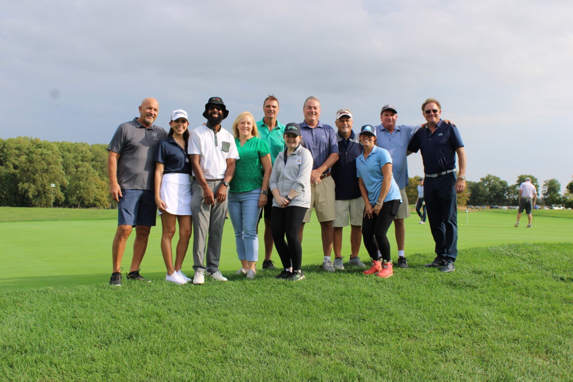 Hospice of the Chesapeake’s Golf Committee stands on the putting green before the start of its annual Golf Tournament at Queenstown Harbor Golf Resourt.