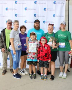 Team Harvey poses before the Blue Crab Fun Run race begins.