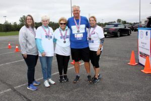 Hospice of the Chesapeake leaders meet up at the Blue Crab Fun Run finish line. Pictured from left are President and CEO Becky Miller, Foundation Board Vice Chair Liz Freedlander and Board of Directors Secretary Tricia Lehman, Vice Chair Rich Wilder, and Chair Nancy Smit.